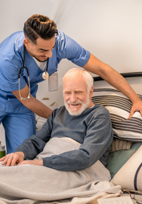 Young woman in hospital bed receiving cancer treatment, reflecting resilience.